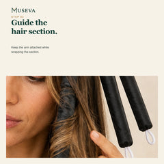 Close view of hair being guided around one attached curling arm.