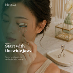 Woman aligning the MUSEVA wide-jaw eyelash curler with her upper lash line.