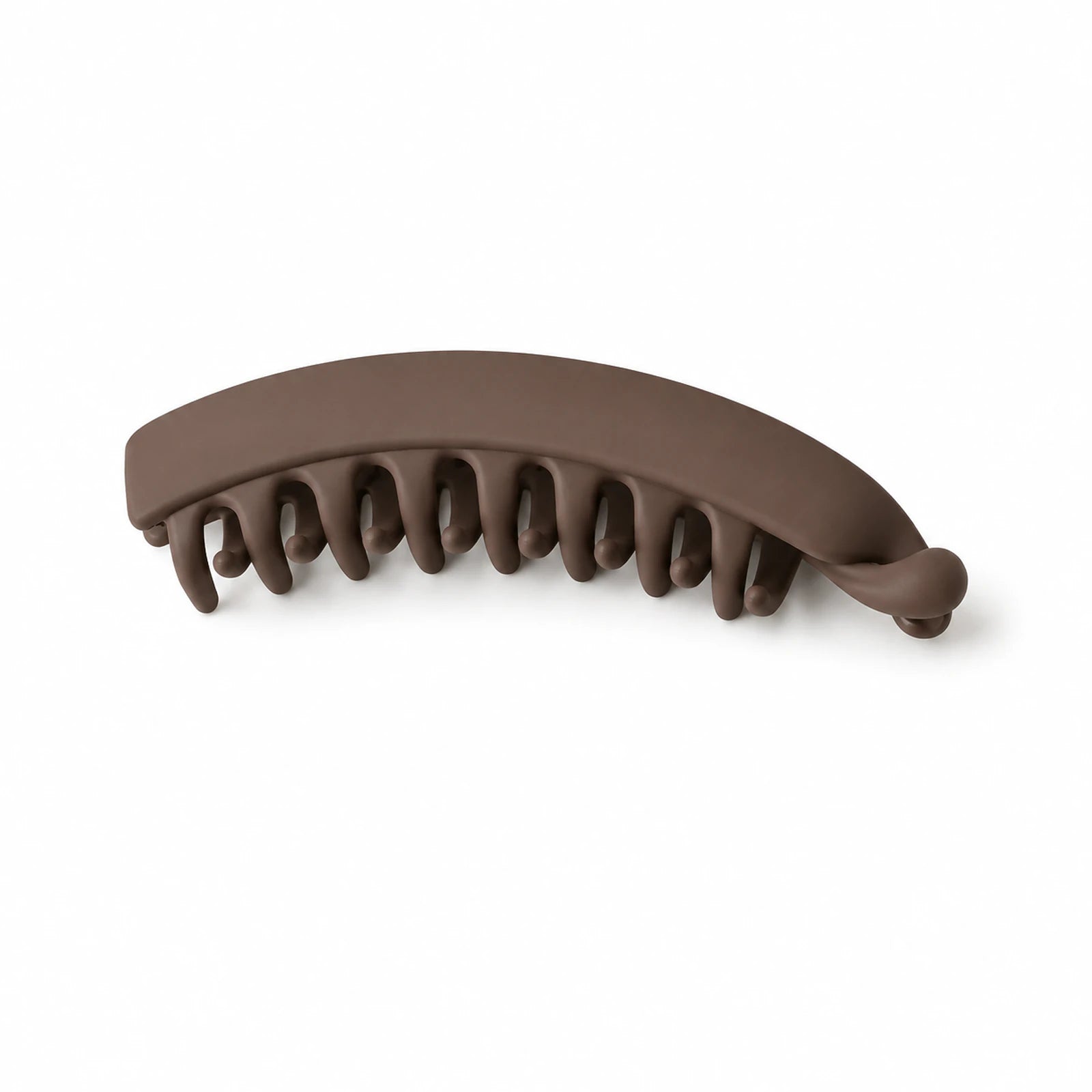 MUSEVA brown vertical banana clip form with curved body and visible teeth on warm ivory.