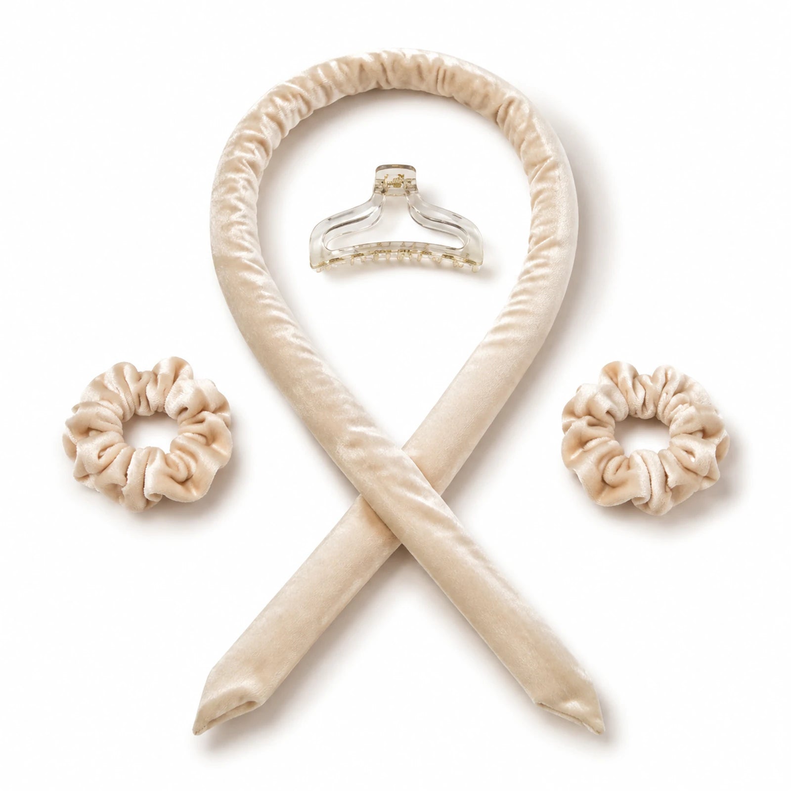 Beige U-shaped heatless curling band, two scrunchies and one clear claw clip on white.