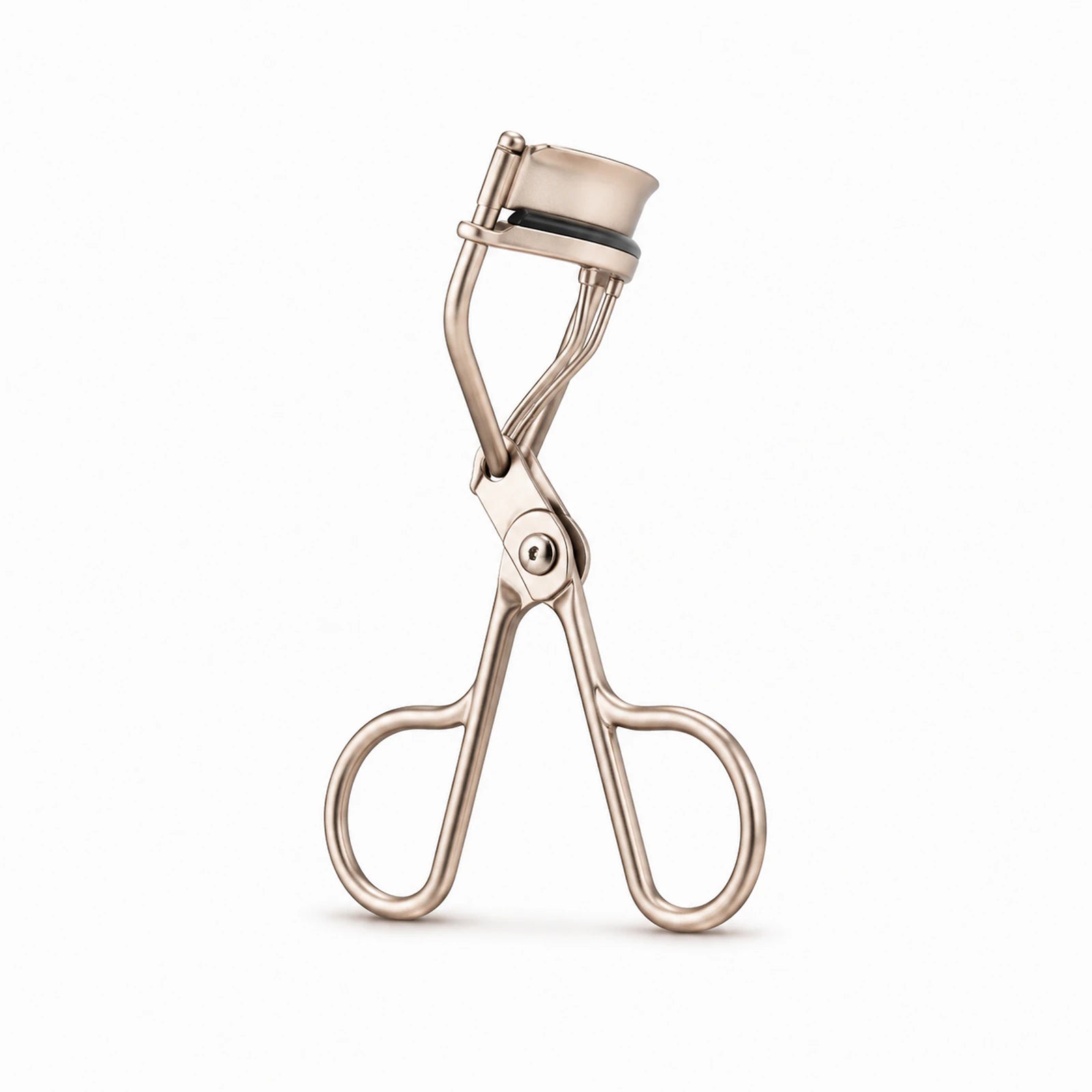 MUSEVA mini partial lash curler with a narrow jaw on a warm ivory background.