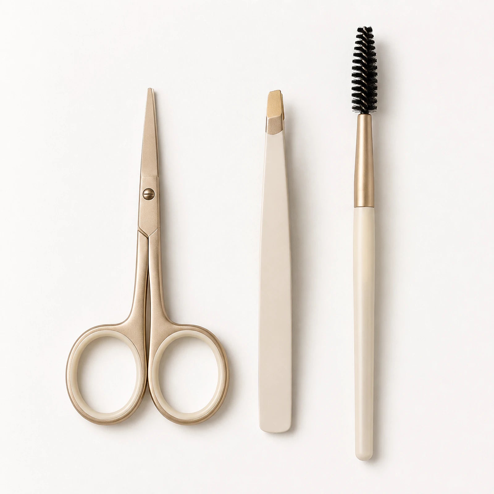 MUSEVA brow scissors, slant-tip tweezer and spoolie on a white background.