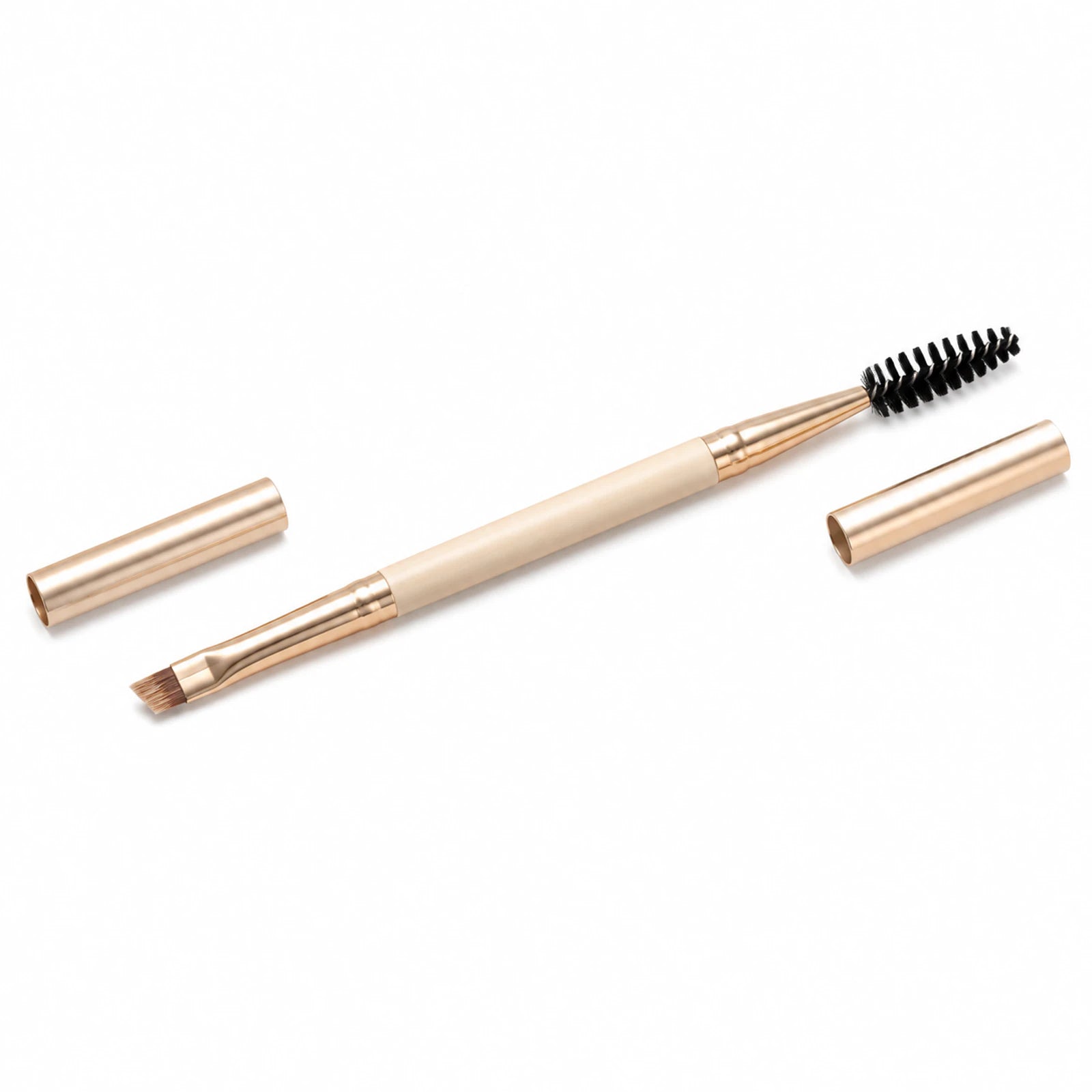 MUSEVA capped double-ended brow and lash brush on a warm ivory background.
