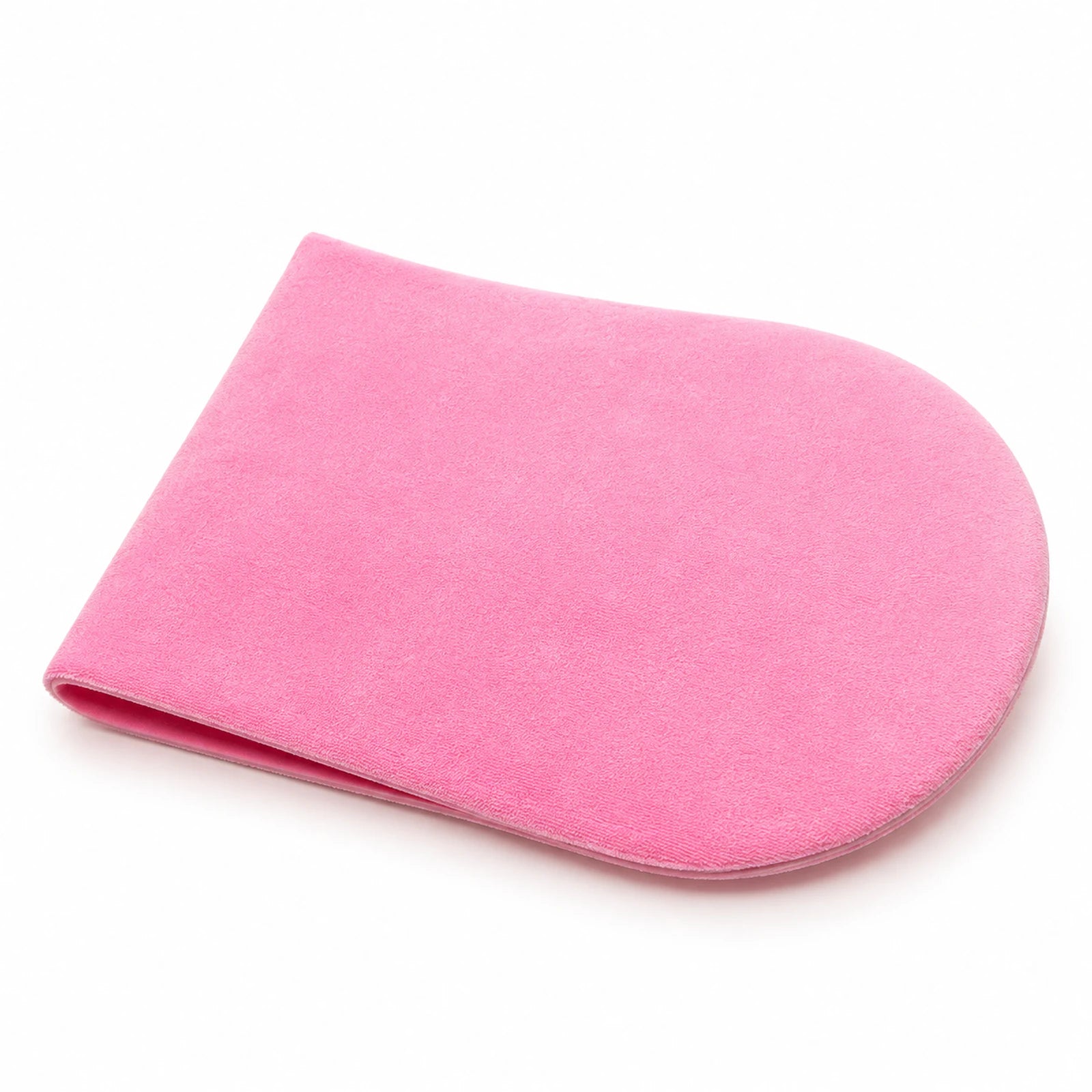 MUSEVA pink body application mitt form with rounded face on warm ivory.