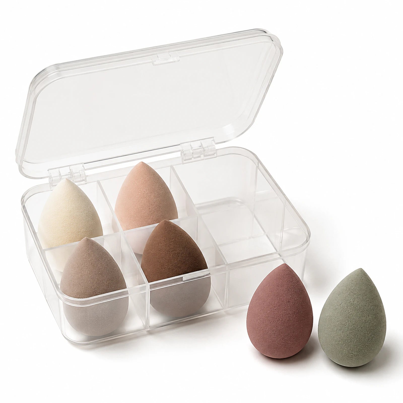 Six muted teardrop makeup sponges in one clear six-compartment case.