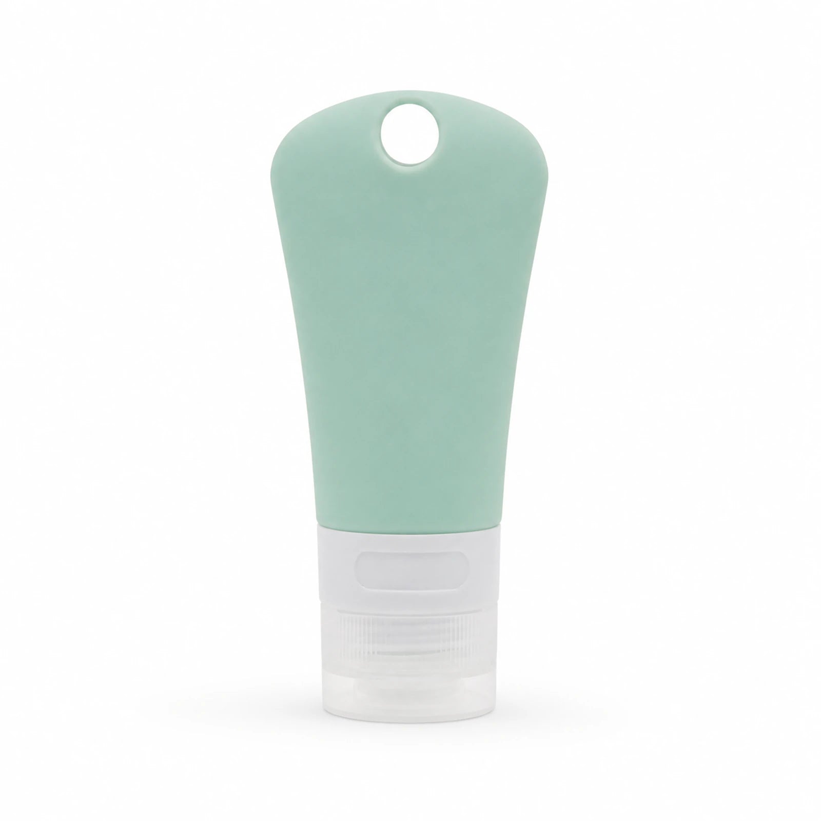 MUSEVA mint-green squeeze travel bottle with closed cap on warm ivory.