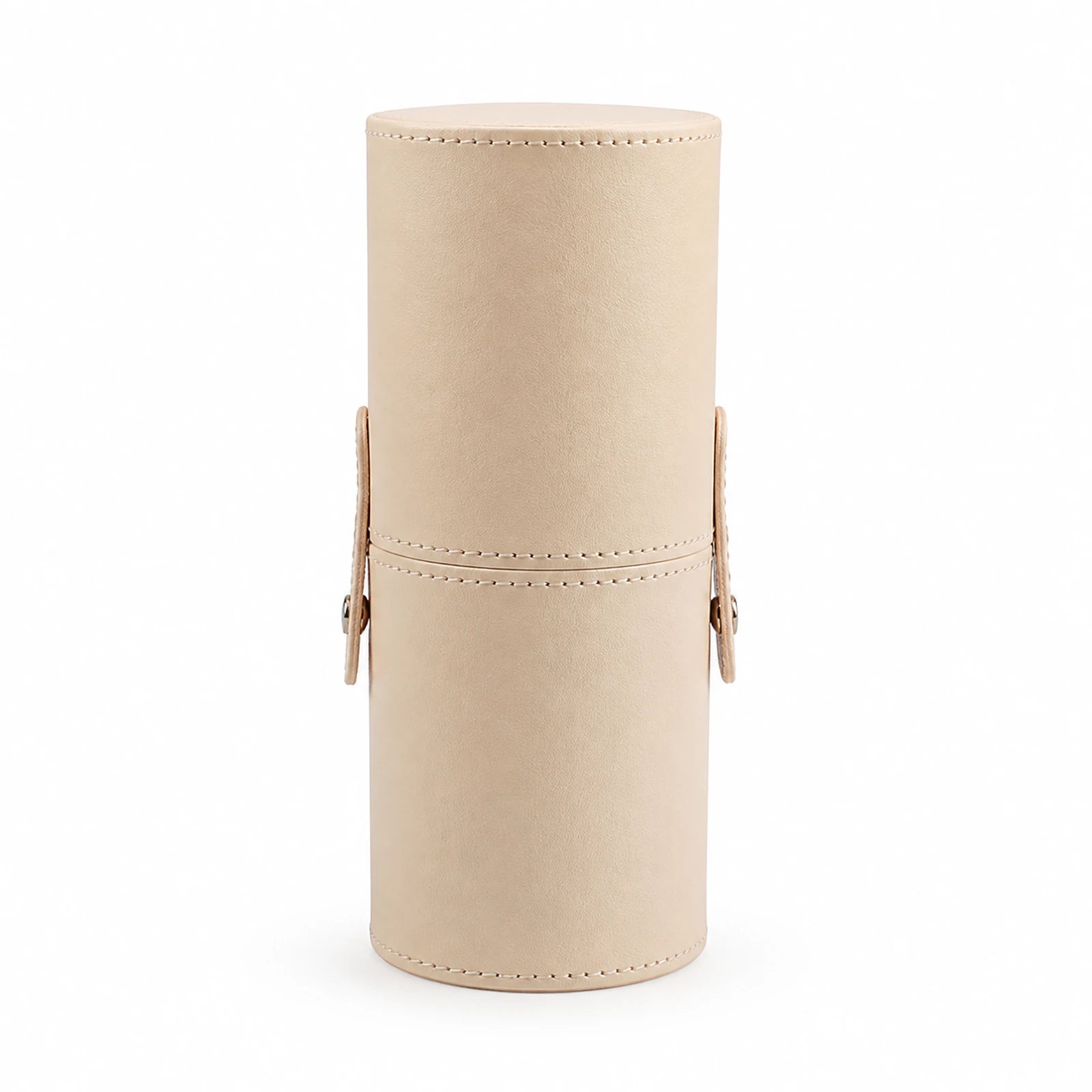Closed apricot-beige cylindrical MUSEVA travel brush holder on a white background.